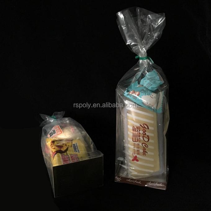 安いプラスチック パッキングの平底Oppはキャンデーのクッキーのパン屋のチェロのギフト袋のための御馳走パーティの記念品袋を袋に入れる